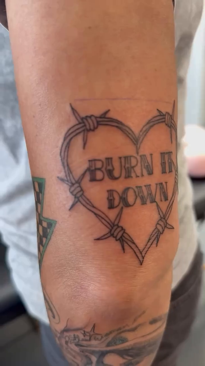 Tattoo by @akira.inkz — lettering_script, blackwork