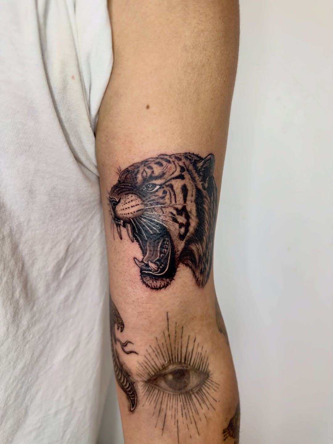 Tattoo by @21.12_ink โ realism, black_and_grey