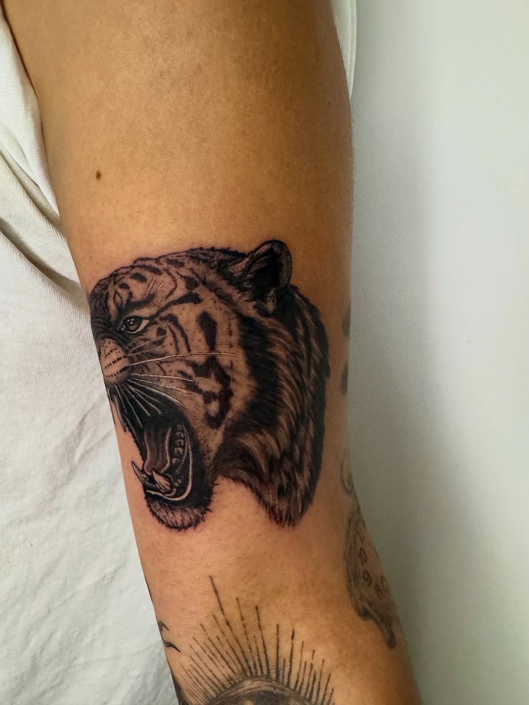 Tattoo by @21.12_ink โ realism, black_and_grey