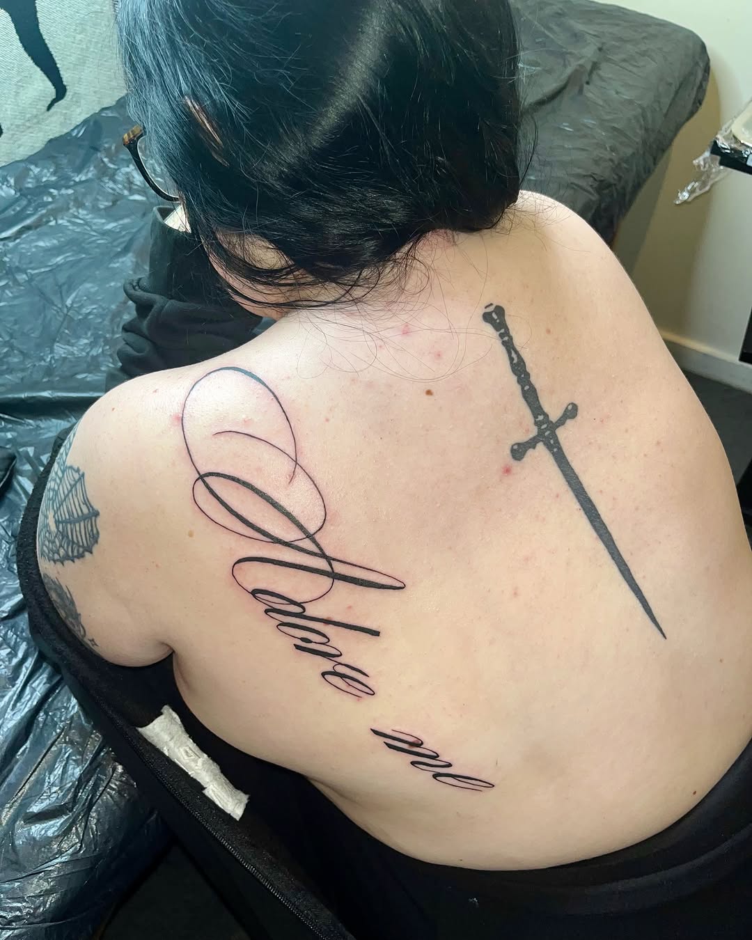 Tattoo by @mwah.ttt — lettering_script, blackwork