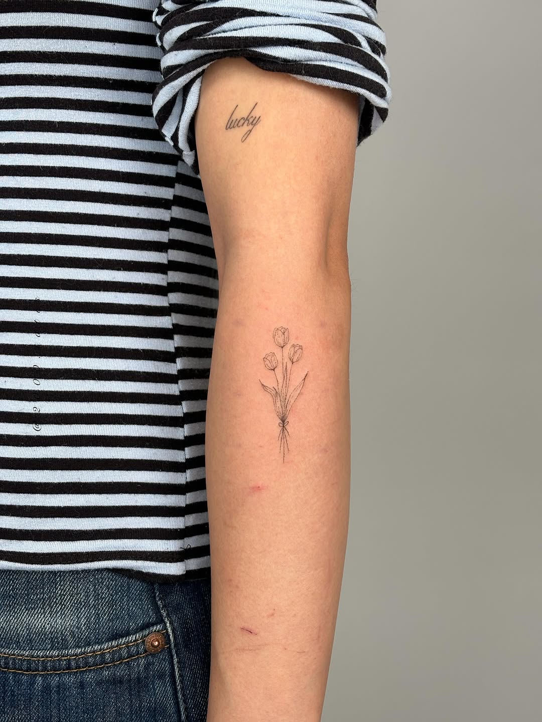 Tattoo by @2000.tatts โ fine_line, lettering_script