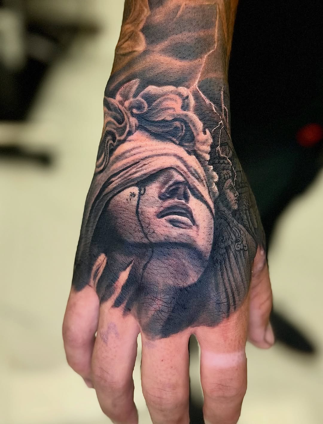 Tattoo by @tuannguyen_tattoo — realism, black_and_grey