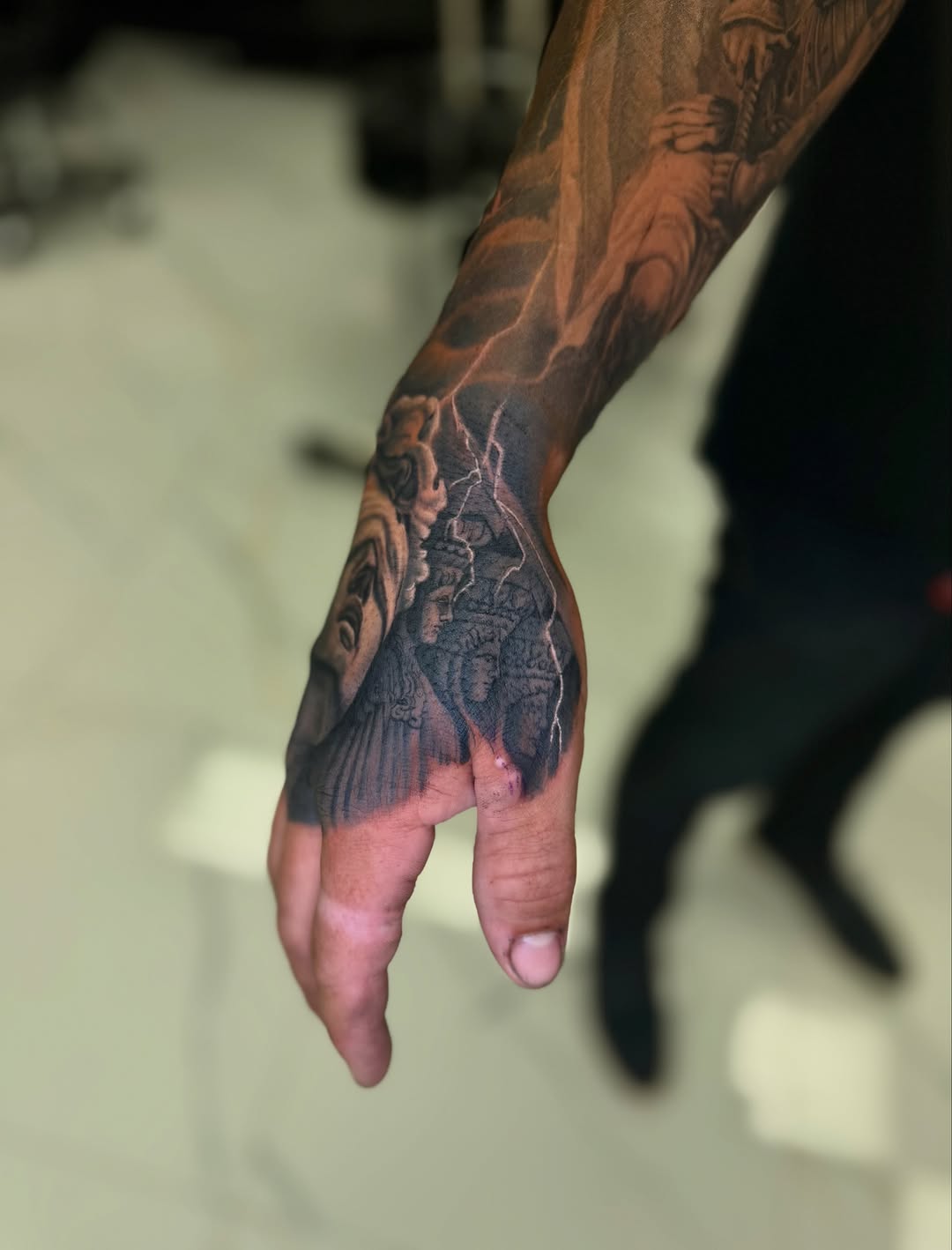Tattoo by @tuannguyen_tattoo — realism, black_and_grey