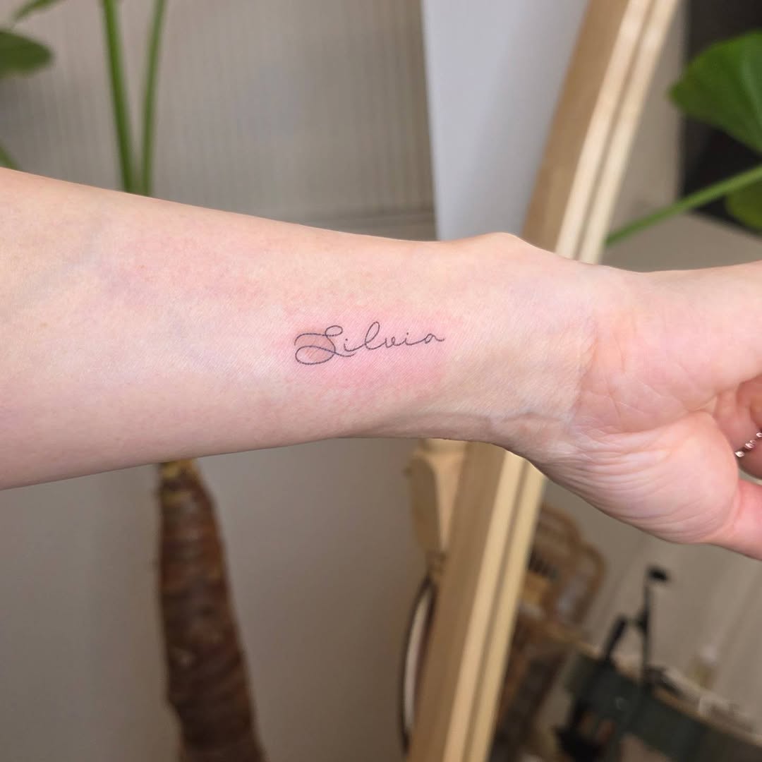 Tattoo by @nurimoon_tattoo — lettering_script, fine_line
