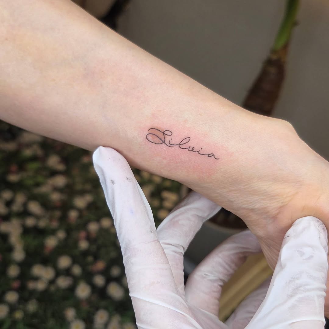 Tattoo by @nurimoon_tattoo — lettering_script, fine_line