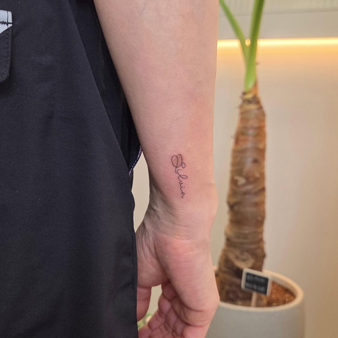 Tattoo by @nurimoon_tattoo — lettering_script, fine_line