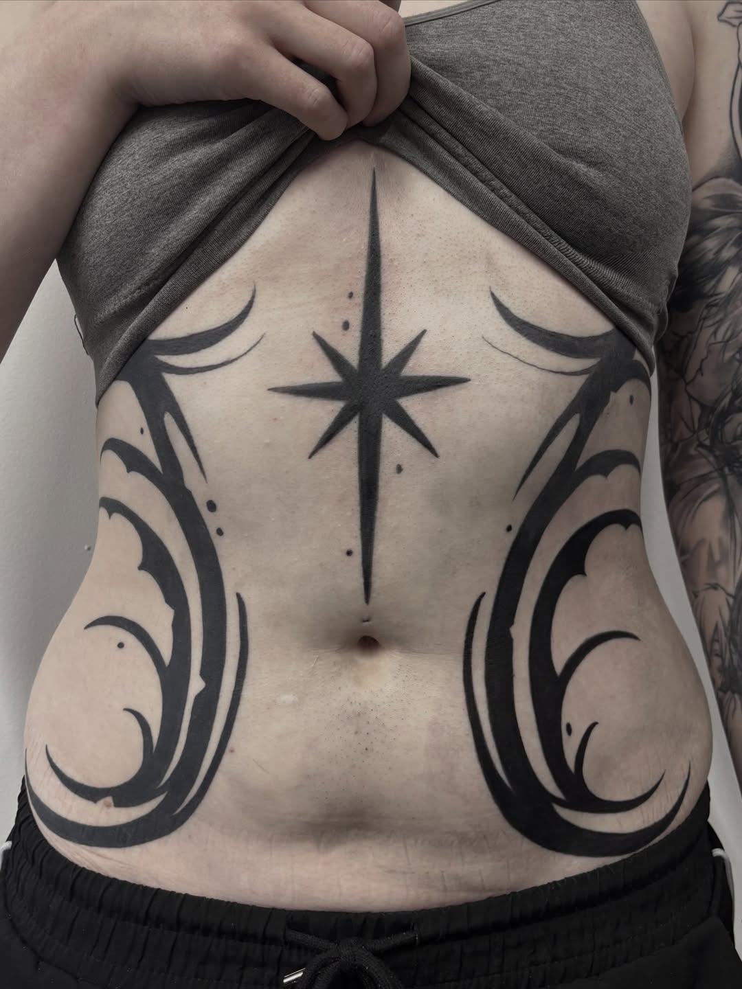 Tattoo by @osichristattoos — blackwork